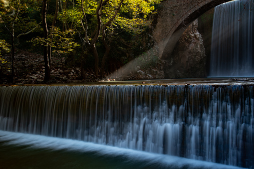 Stone bridge and waterfall of palaiokarya in Trikala, Thessaly, Greece.