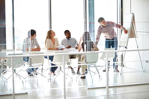 istock Making sure his staff are on top of their game 181880474