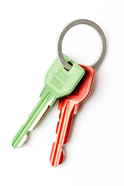 istock Red and green keys with key ring on white background 181880545