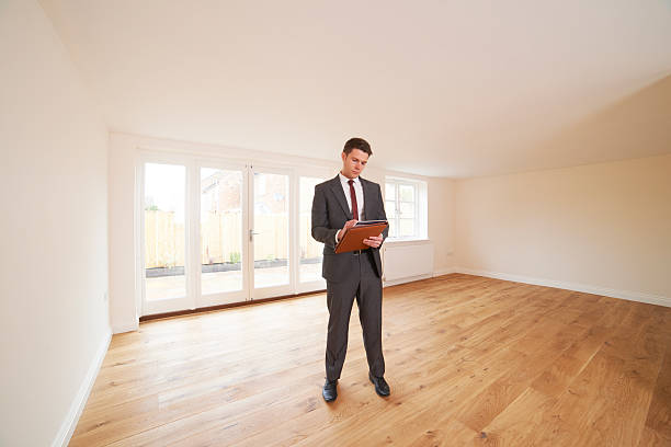 istock Estate Agent Looking At Vacant Property 181880798