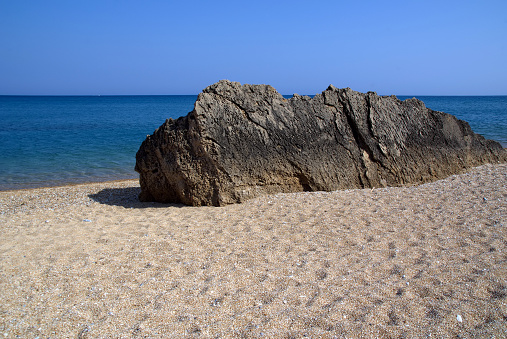view of the Skala beach against the sea and rocks