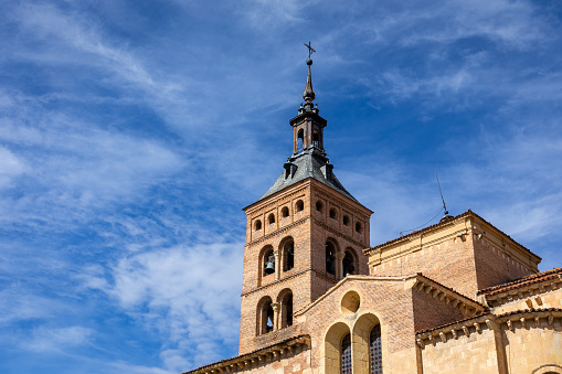 Iglesia de San Martin (Church of San Martin) Romanesque - Mudejar style bell tower with brick arches on stone columns, Segovia, Spain.
