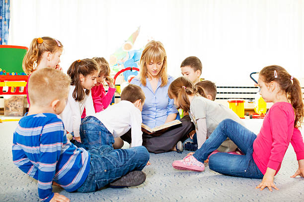 istock Teacher Telling A Story to Children. 181881320