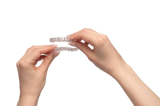 istock Transparent mouth guard in a woman's hand isolated. 1818813871