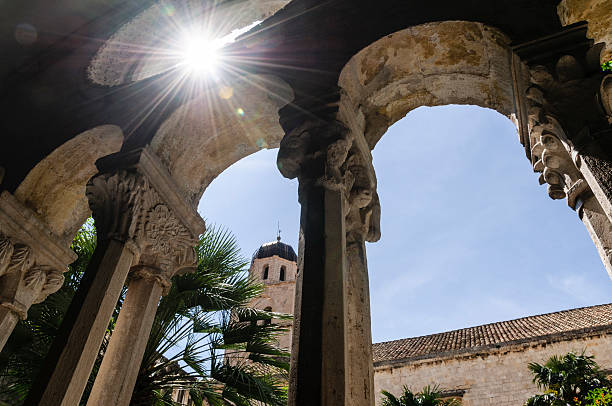 istock Sunburst through window in wall of arches 181881505