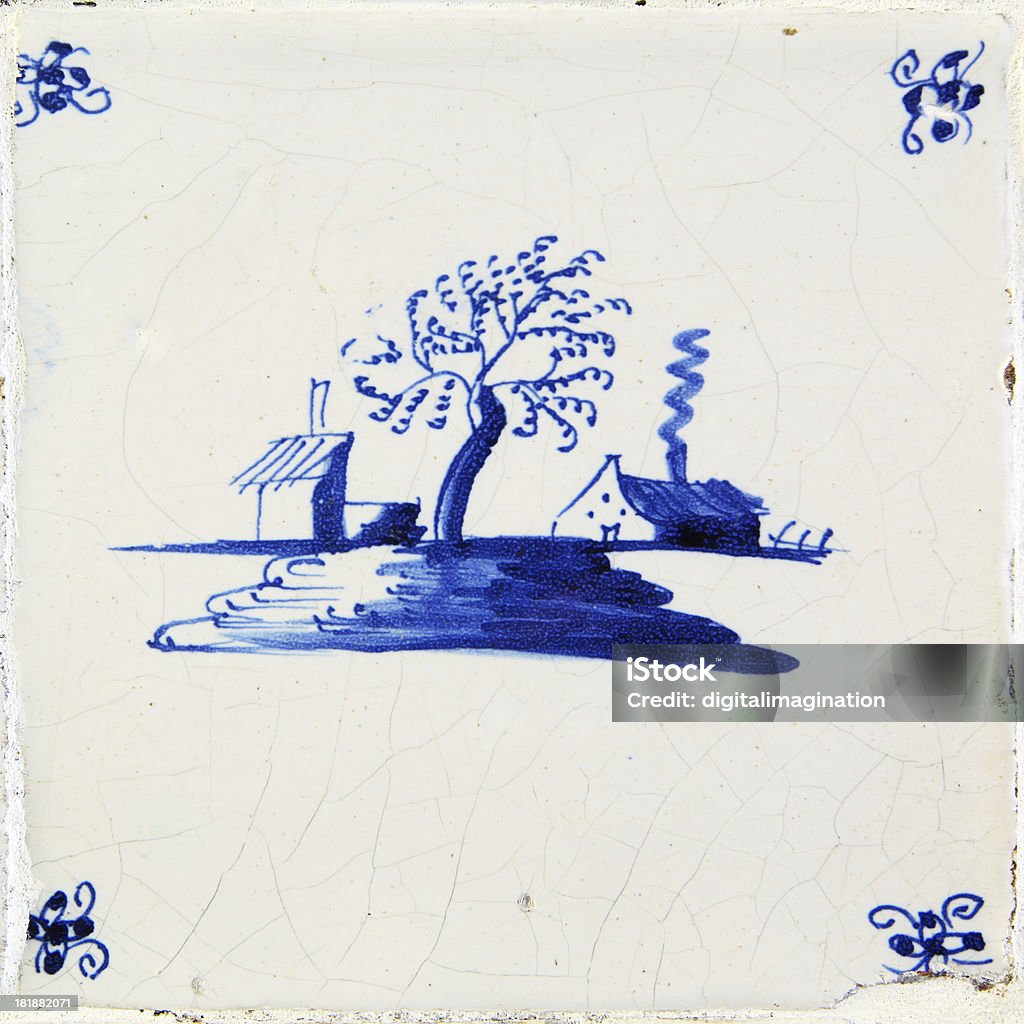 Antique Delft Blue and white tile "Antique Delft blue and white tile.The tile wall of wich this tile a part is, is made at the begin of the 19th Century." Blue Stock Photo