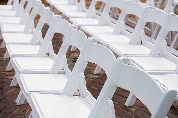 istock Row of White Chairs Set Up for Event Seating 181882163