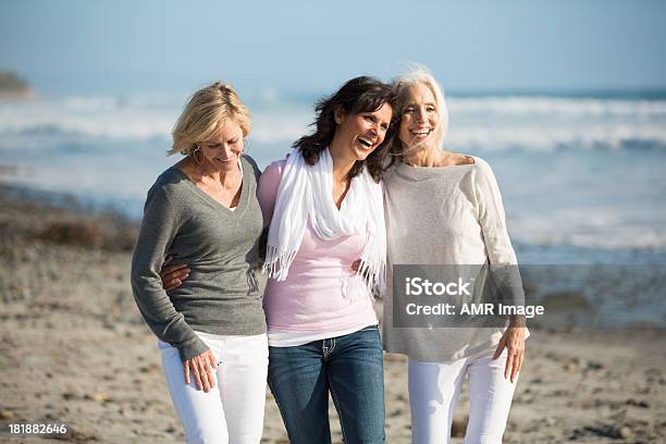 Trio Of Women Walking At The Beach Stock Photo - Download Image Now - Mature Women, Women, Group Of People