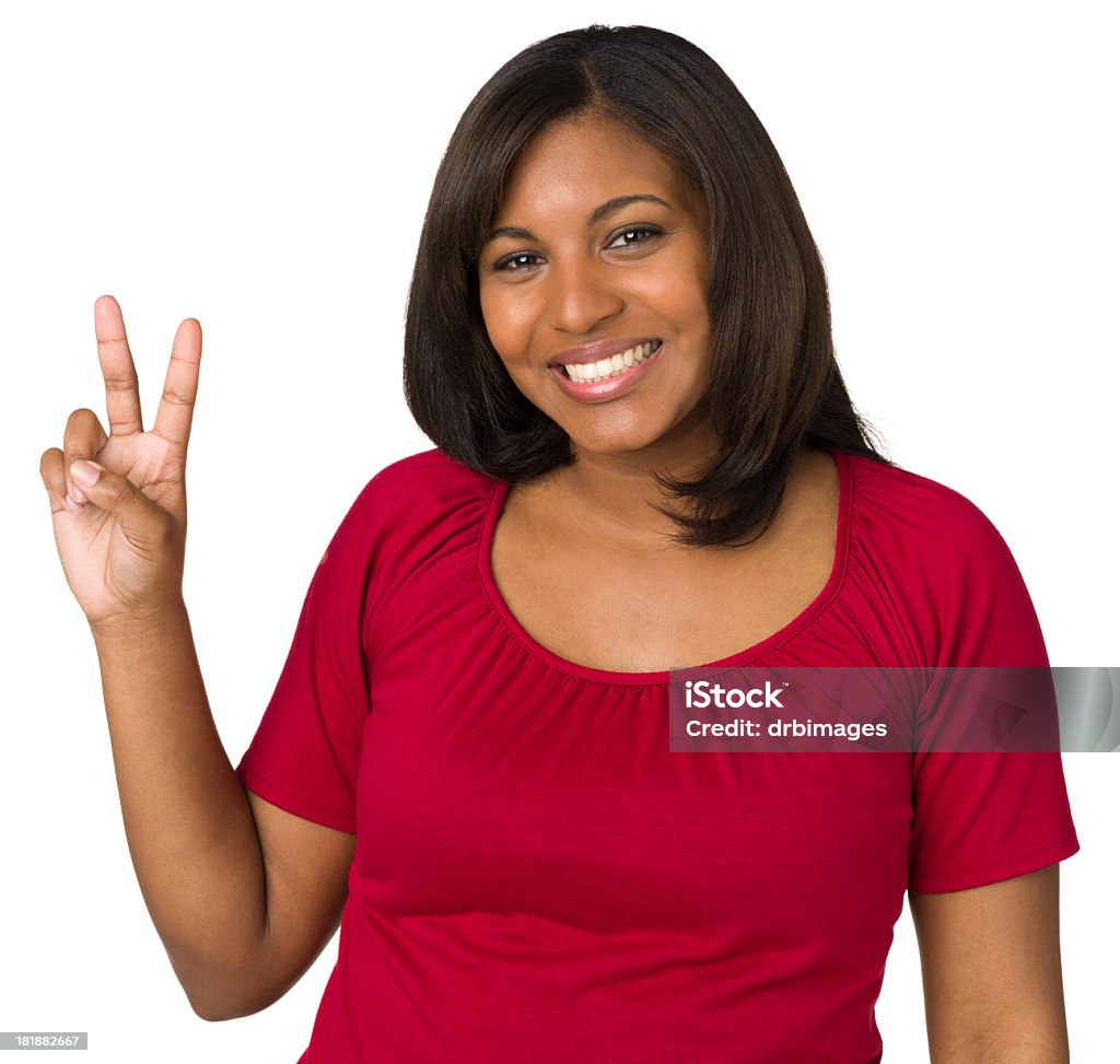 Lächelnde Junge Frau gibt Peace-Zeichen Zwei-Finger-Geste - Lizenzfrei Eine Person Stock-Foto