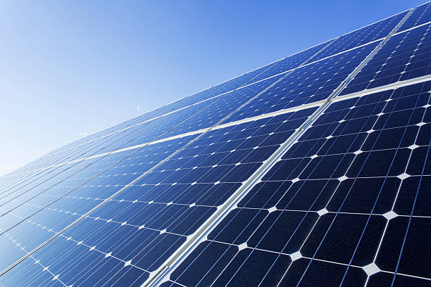 istock Solar panels on a sunny day against clear blue sky 181882753