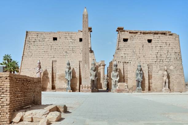 istock Luxor temple facade with stone statues representing Egyptian pharaohs and a 25-meter-high obelisk 1818842673