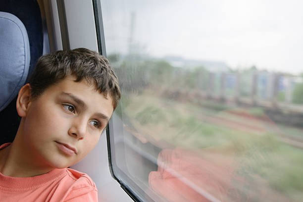 istock Dreaming Travelling Boy in Train 181884435
