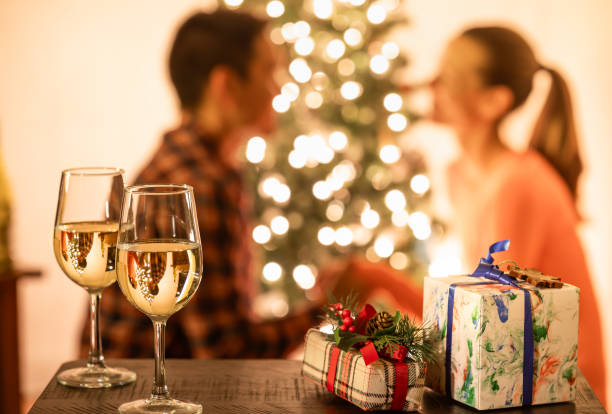 istock Young couple enjoying a romantic Christmas Eve. 1818848021