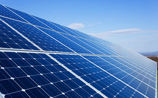 istock Solar panels on a sunny day against clear blue sky 181884845