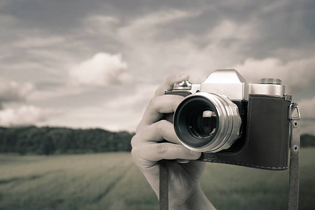 istock Photographing landscape with an old photo camera 181884868