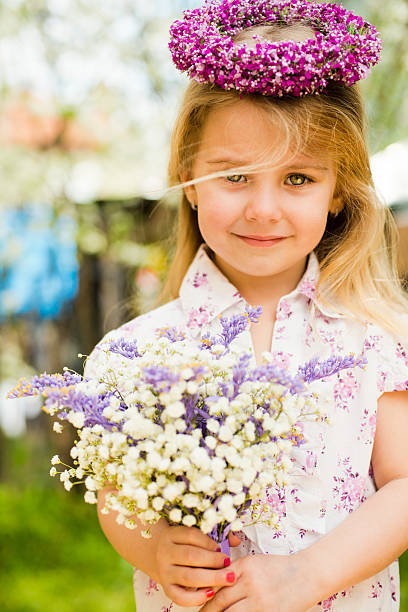 istock Little girl with flowers 181884934