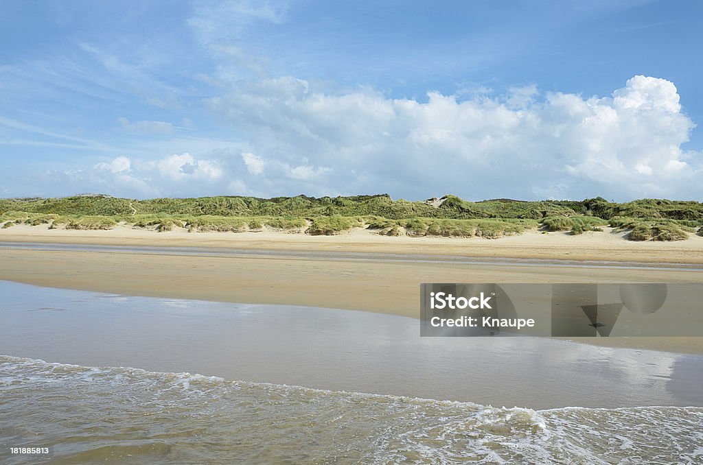 View to Sand Dunes with marram grass from ocean surf Atlantic Ocean Stock Photo