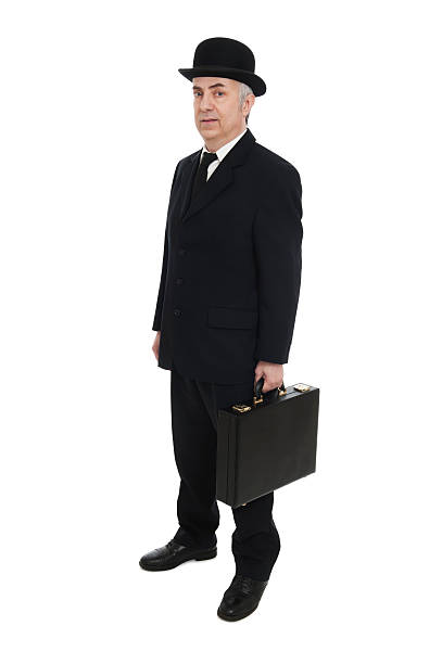 istock Traditional Businessman in Bowler Hat Holding Briefcase 181885975