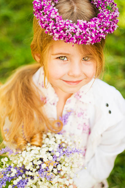 istock Little girl with flowers 181886007