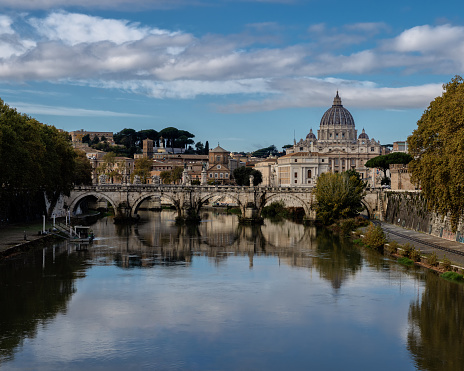 A view of St Peter's Basilica seen across the River Tiber from Pont St Angelo in Rome Italy