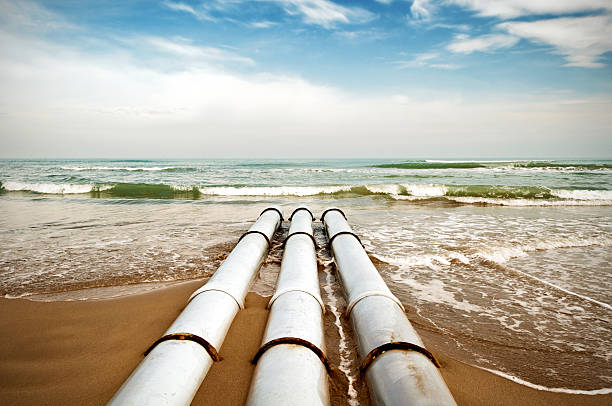 Sewer Pipes On The Beach stock photo