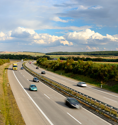 Trucks and Cars Driving on Motorway