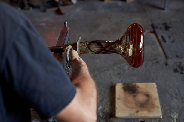 istock Crop craftsman making glass hookah base in workshop 1818869323