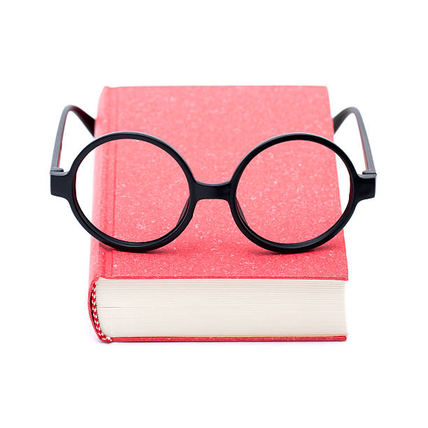 istock Books and glasses isolated on white background 181887165