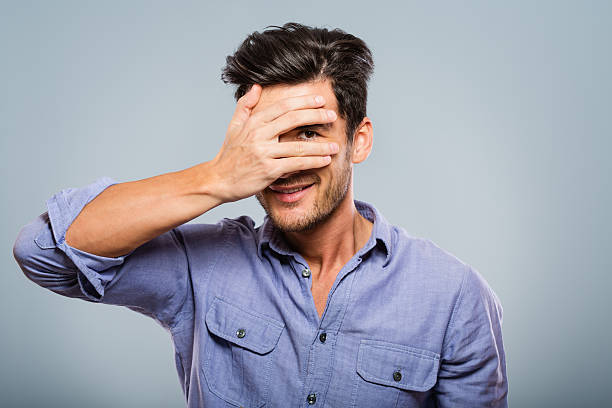 istock Man covering his eyes, peeking 181887259