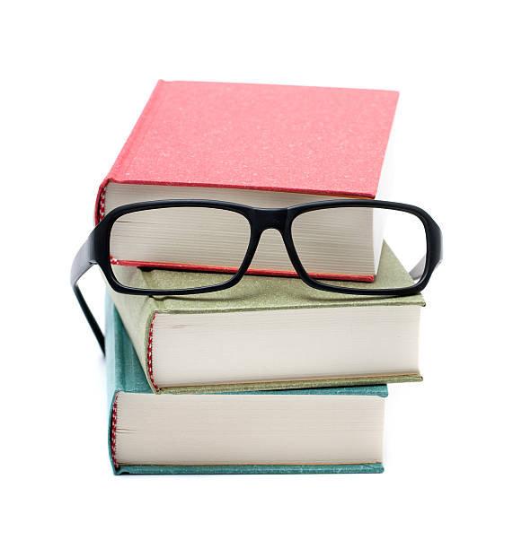 istock Books and glasses isolated on white background 181887331