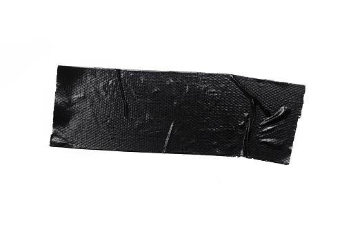 A piece of general purpose vinyl black tape isolated on white