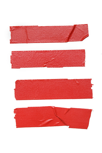 Set of pieces of general purpose vinyl red tape isolated on white