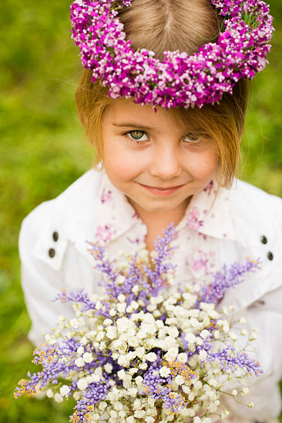 istock Little girl with flowers 181888168