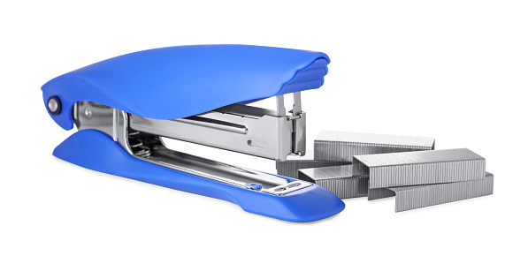Bright blue stapler with staples isolated on white
