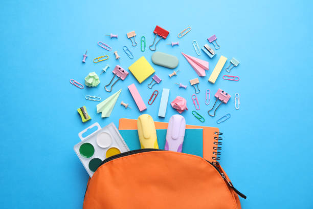 istock Back to school. Many different school stationery and paper planes on light blue background, flat lay 1818882346