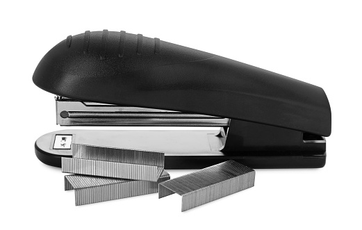 New black stapler with staples isolated on white