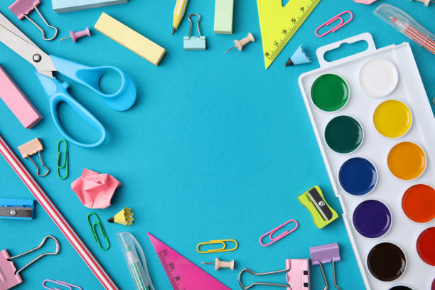 istock Frame made of different school stationery items on light blue background, flat lay with space for text. Back to school 1818882366