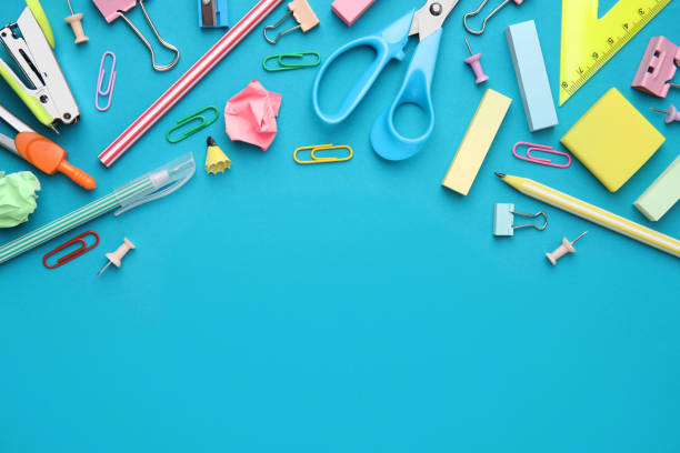 Different school stationery items on light blue background, flat lay with space for text. Back to school