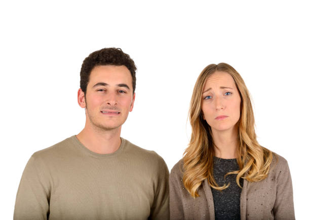 istock Young sad couple on white background 1818882902