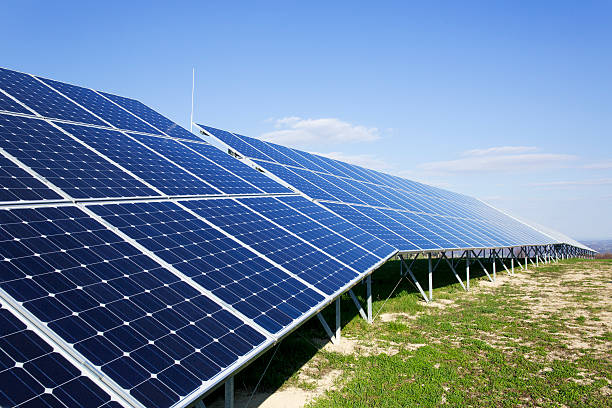 istock Solar panels on a sunny day against clear blue sky 181888353