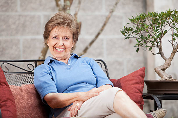 istock Senior woman sitting on patio 181888529