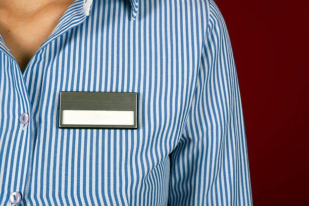 A woman with a blank name tag on her shirt
