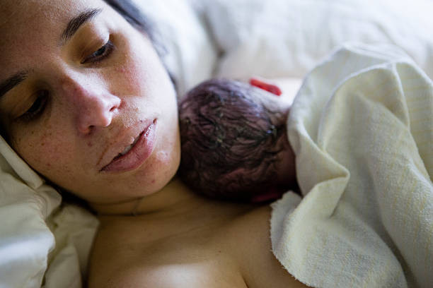 Look at her baby Relax in the bed home birth photos stock pictures, royalty-free photos & images