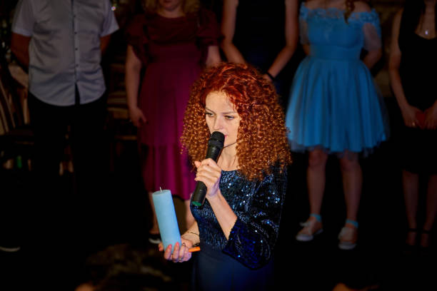 istock Host of a wedding ceremony, festive event with a candle,microphone 1818896666