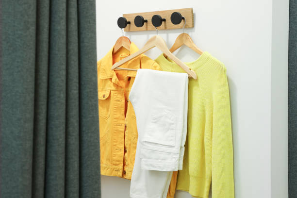 istock Stylish women's clothes on rack in dressing room 1818905521