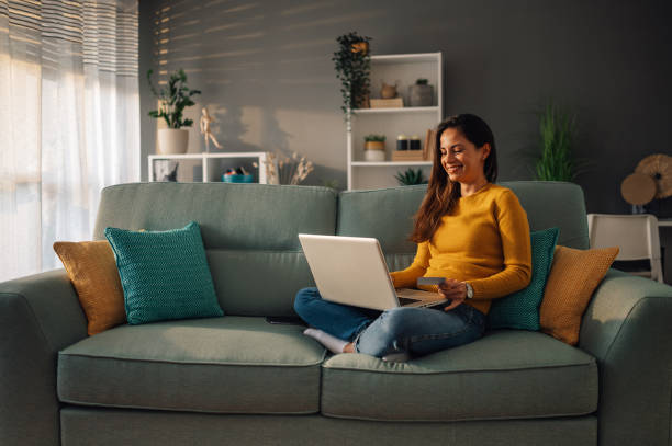 istock A young woman is using technologies for online shopping from home. 1818907826