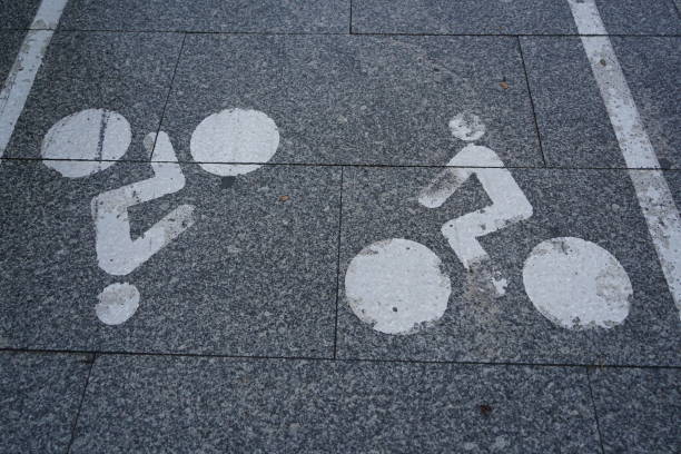 istock Indicative bicycle lane sign painted in white on the ground 1818908391