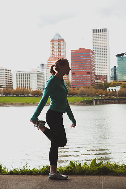 istock Athletic Young Woman Stretching Before Run 181890894