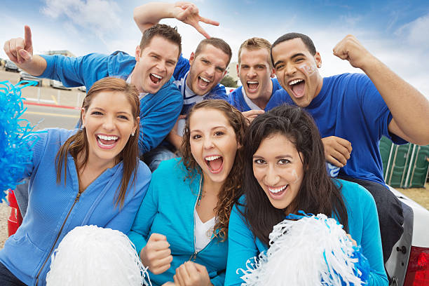 Group of cheering sports fan tailgating at stadium Group of cheering sports fan tailgating at stadium. tailgate party photos stock pictures, royalty-free photos & images