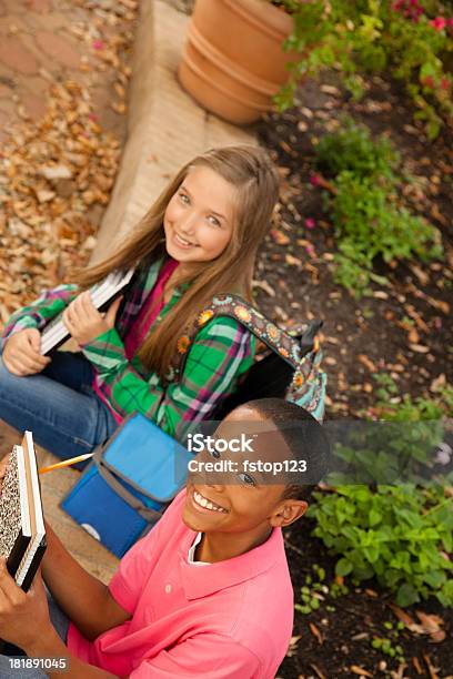 Students Two Elementary Mixed Ethnic Children Waiting For Parents Stock Photo - Download Image Now
